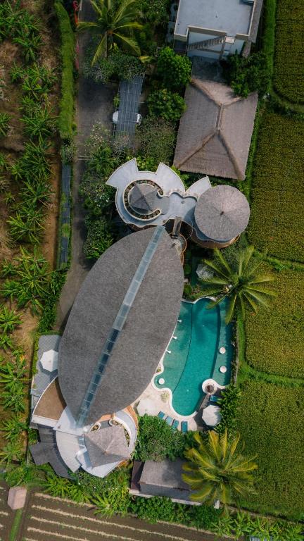 an overhead view of a swimming pool and a resort at Floating Leaf Eco Resort in Gianyar