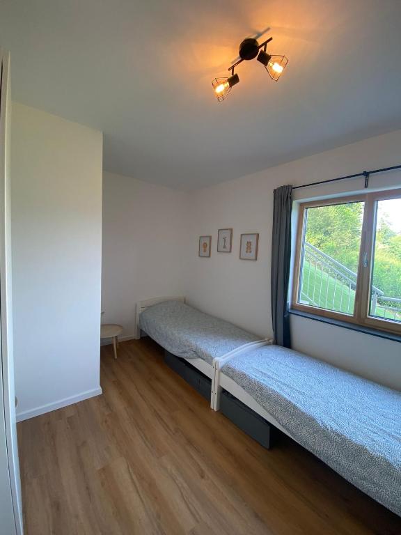 Postel nebo postele na pokoji v ubytování Luxe appartement in Zuid Karinthië