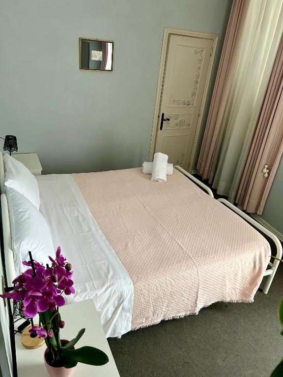 Postel nebo postele na pokoji v ubytování HOTEL LA LOGGIA