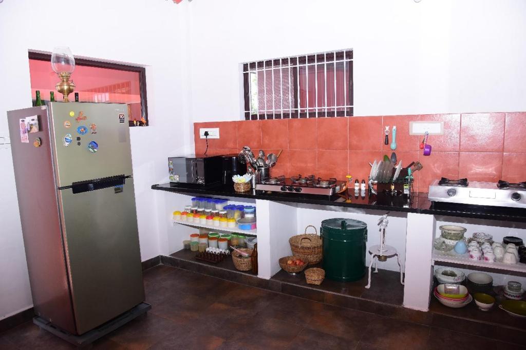 Kuchyň nebo kuchyňský kout v ubytování Aastha homestay