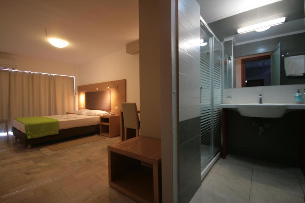 Postel nebo postele na pokoji v ubytování Liberty Hotel