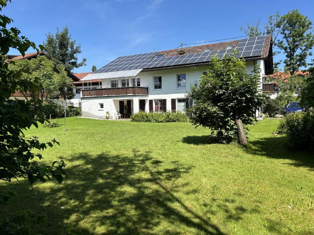 a house with solar panels on the roof at Landhaus Heck in Pfronten