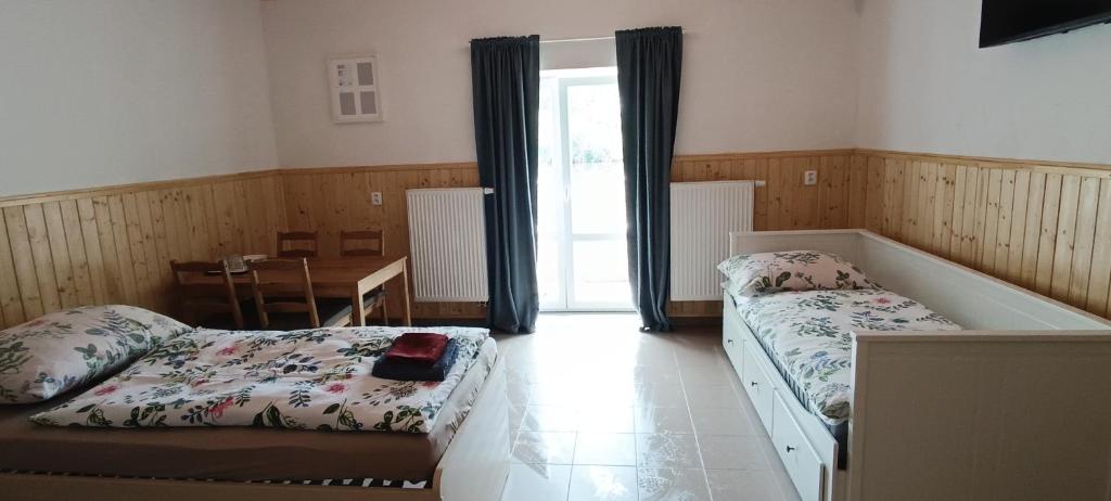 Postel nebo postele na pokoji v ubytování Ubytování U Tajčů