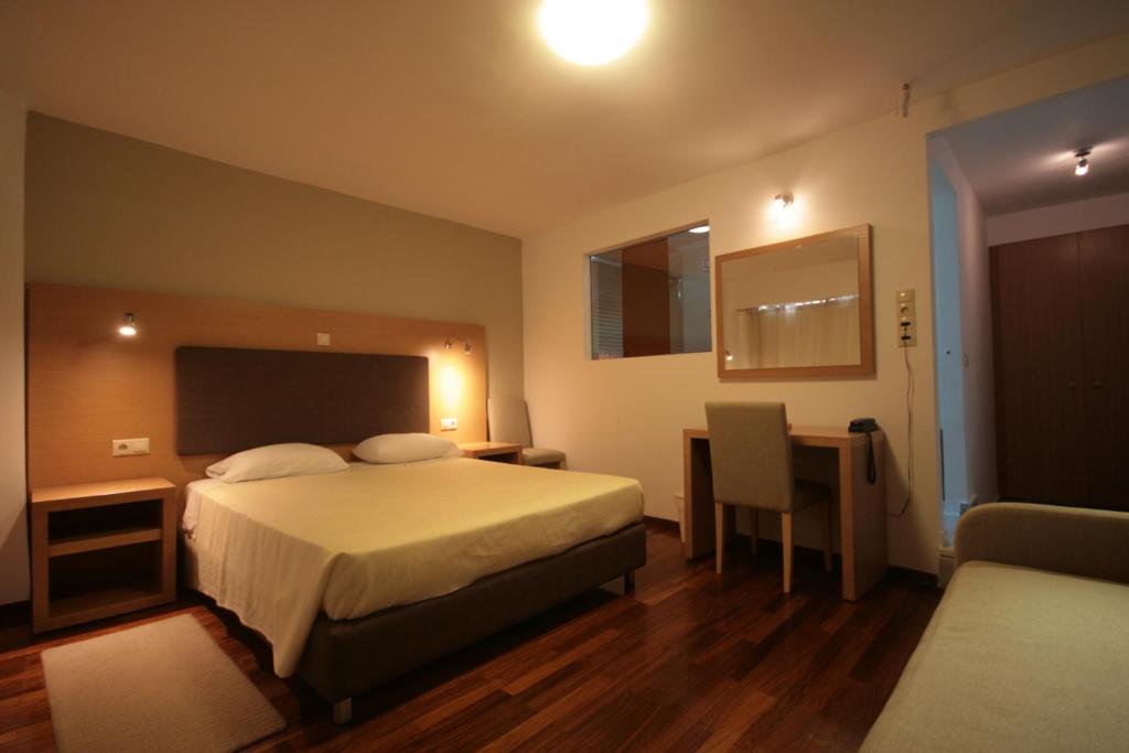 Postel nebo postele na pokoji v ubytování Liberty Hotel