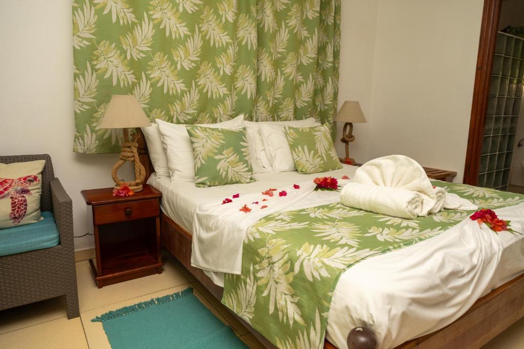 Postel nebo postele na pokoji v ubytování Pension Hibiscus