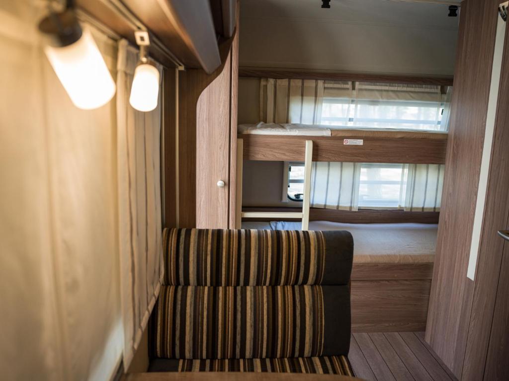 Postel nebo postele na pokoji v ubytování Punta Falconera camping & village