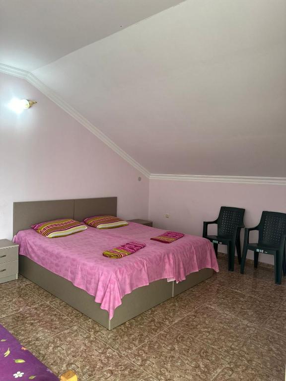 Postel nebo postele na pokoji v ubytování IR Guest House