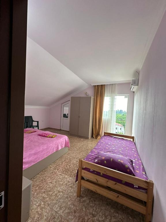 Postel nebo postele na pokoji v ubytování IR Guest House