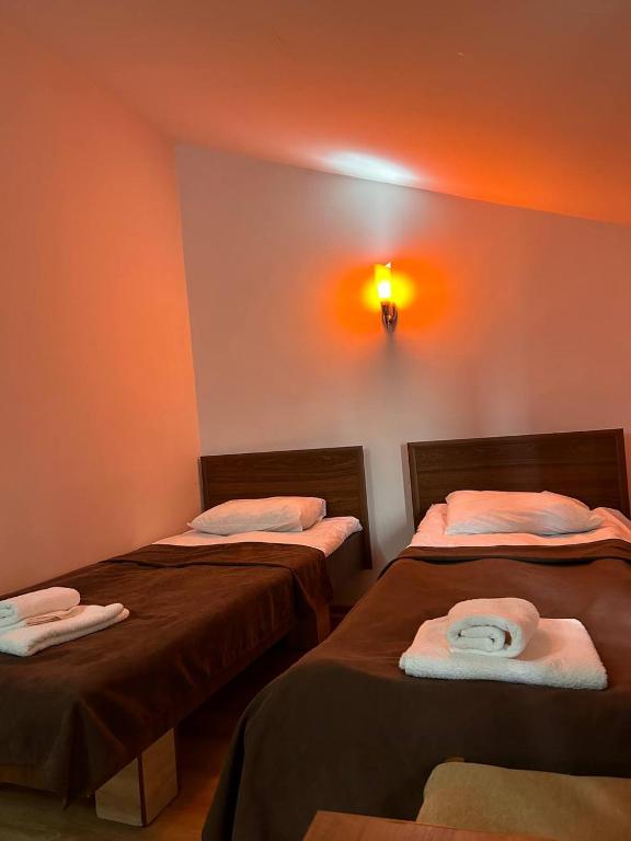Postel nebo postele na pokoji v ubytování Nectar hotel