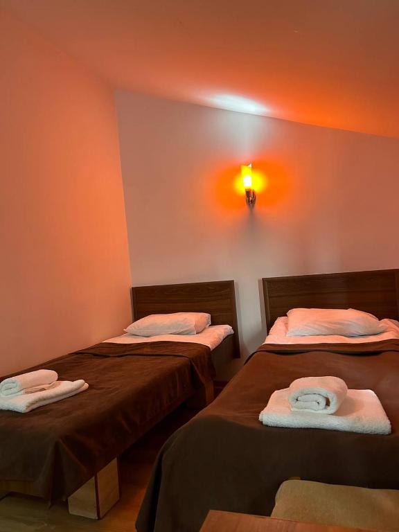 Postel nebo postele na pokoji v ubytování Nectar hotel
