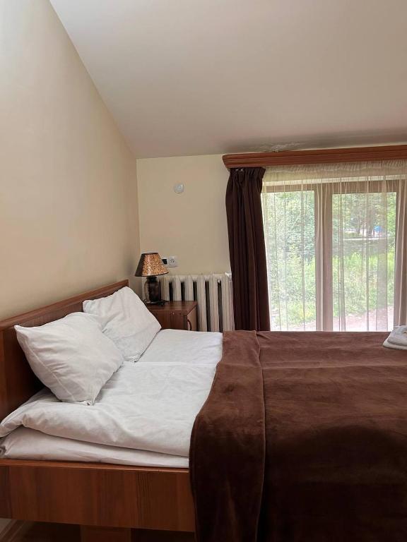 Postel nebo postele na pokoji v ubytování Nectar hotel