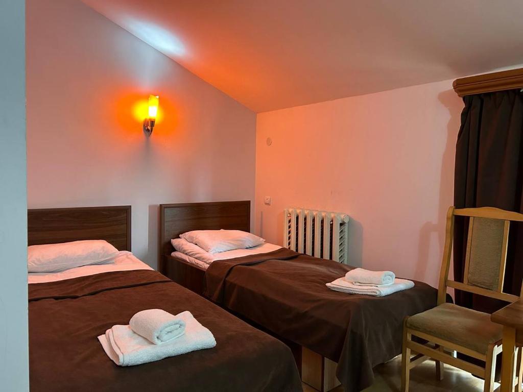 Postel nebo postele na pokoji v ubytování Nectar hotel