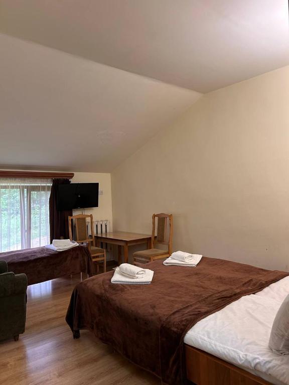 Postel nebo postele na pokoji v ubytování Nectar hotel