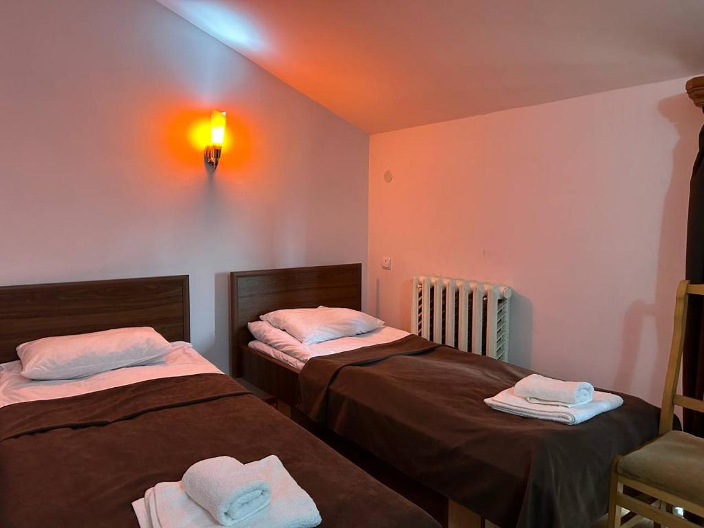Postel nebo postele na pokoji v ubytování Nectar hotel