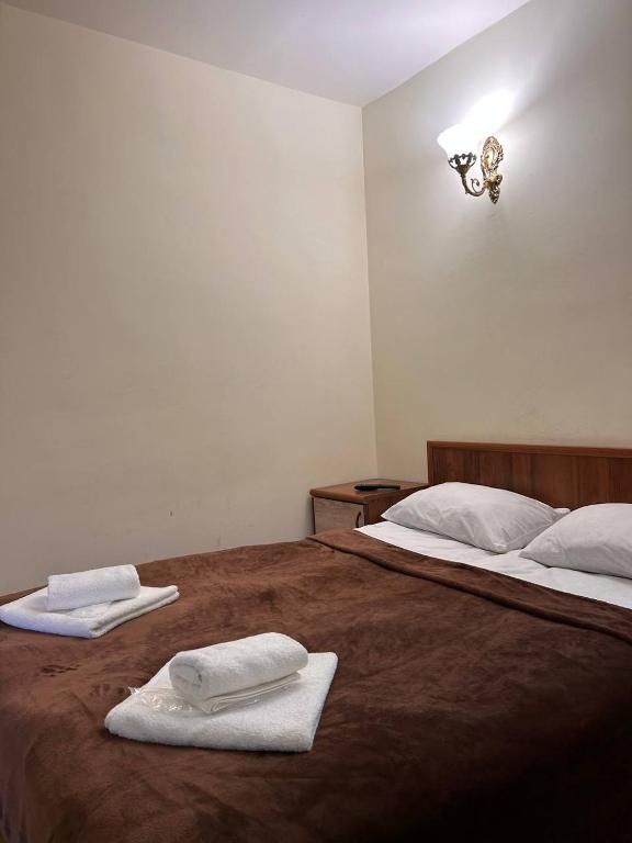 Postel nebo postele na pokoji v ubytování Nectar hotel
