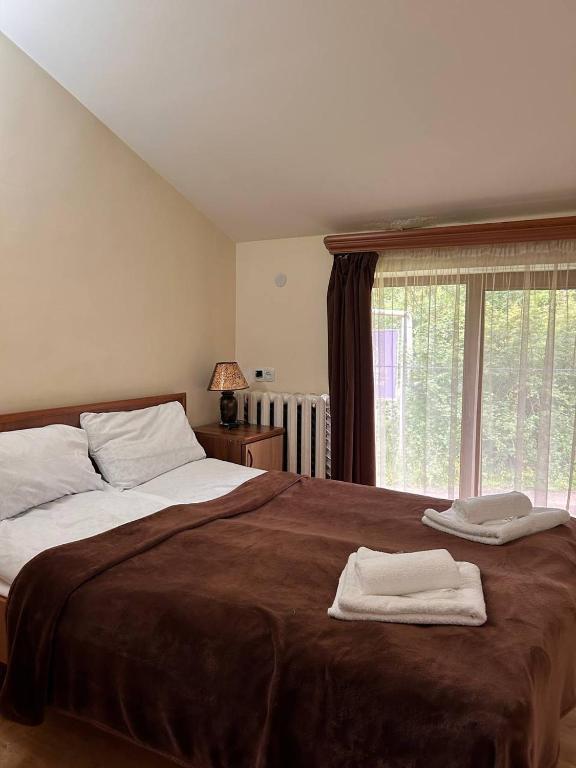 Postel nebo postele na pokoji v ubytování Nectar hotel
