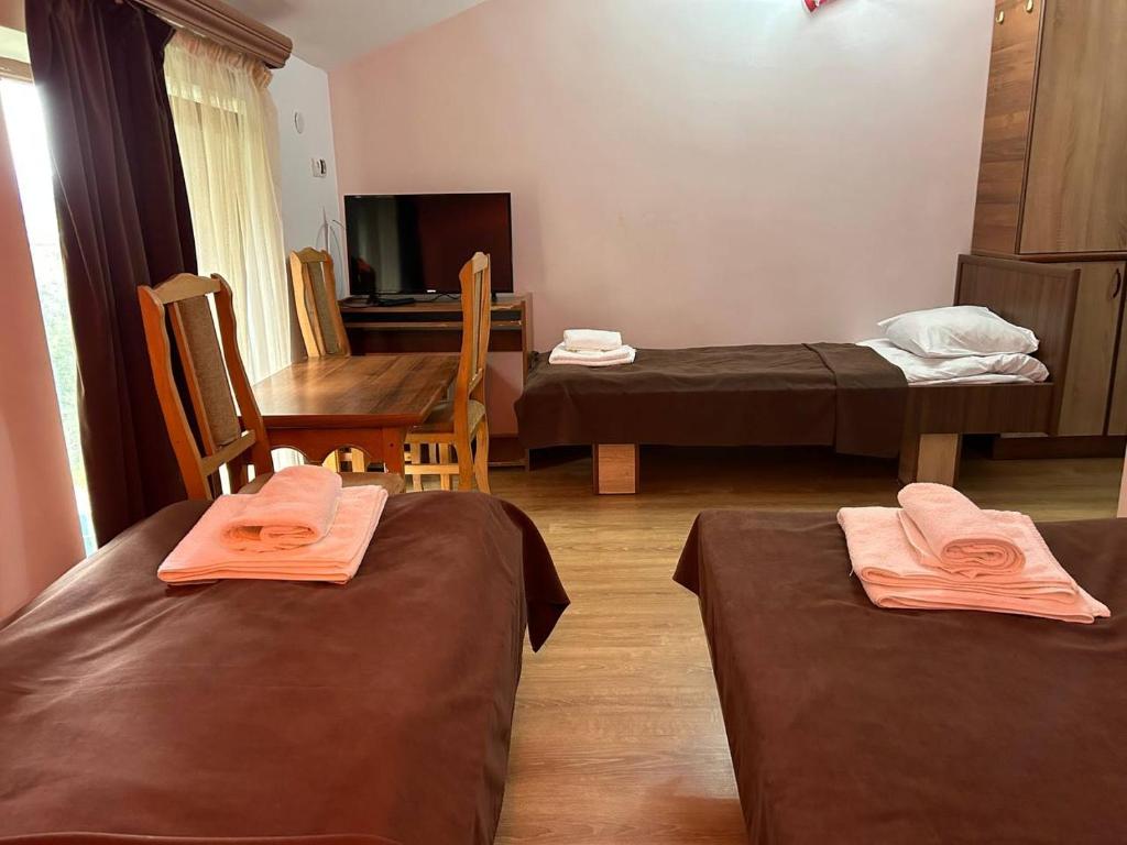 Postel nebo postele na pokoji v ubytování Nectar hotel