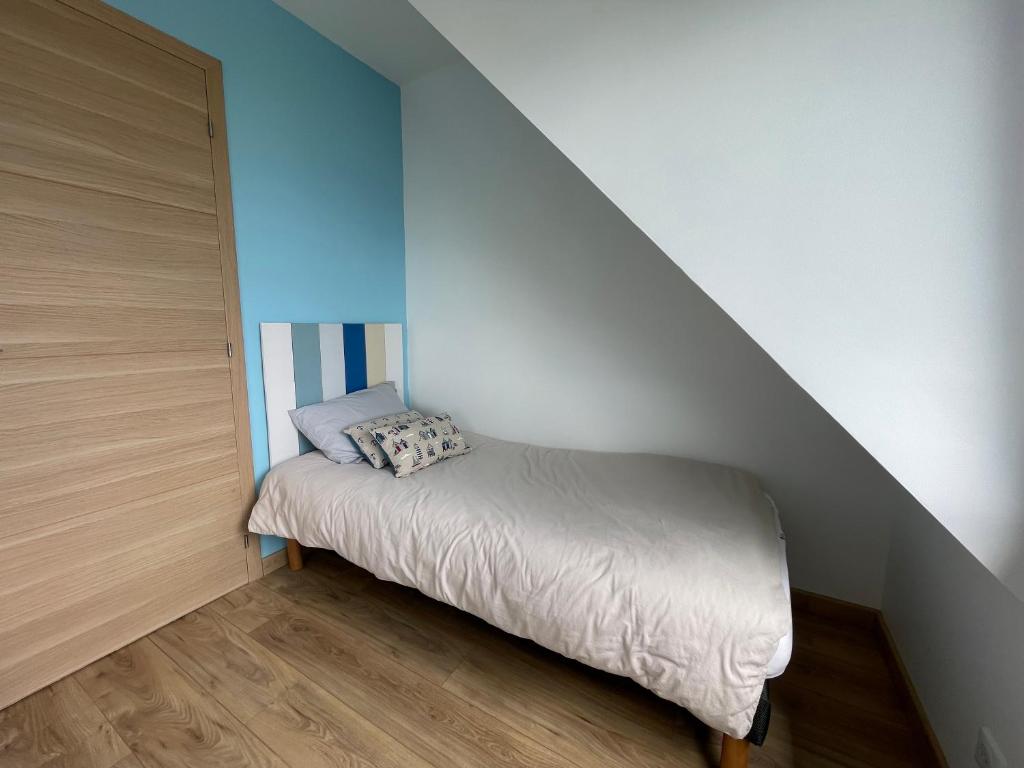 Ein Bett oder Betten in einem Zimmer der Unterkunft Ar Parc Bihan, vue mer!