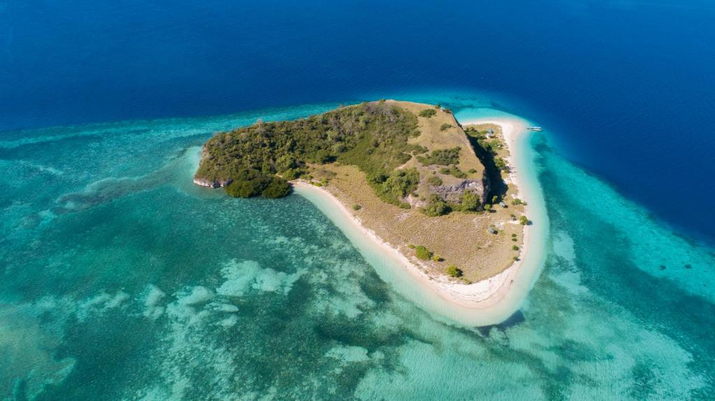 an island in the middle of the ocean at Boat Trip in Riung