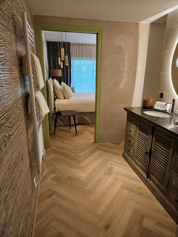 Postel nebo postele na pokoji v ubytování Le Belvédère Hotel et Bien être