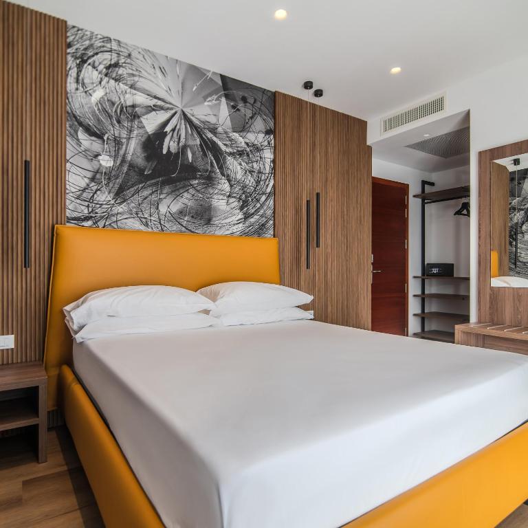 Postel nebo postele na pokoji v ubytování Hotel Cesare Augustus