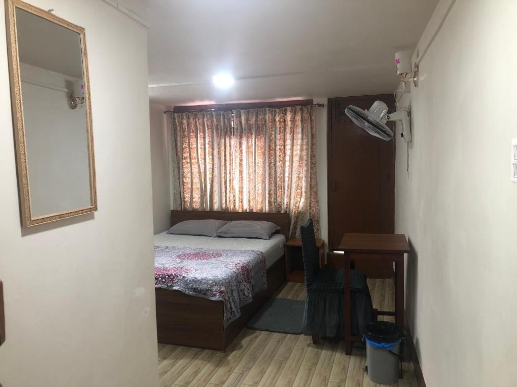 Postel nebo postele na pokoji v ubytování Samriddhi HomeStay