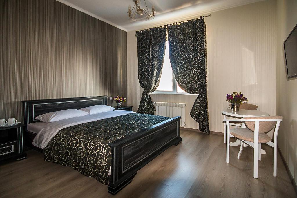 Postel nebo postele na pokoji v ubytování Mini Hotel Ryleev