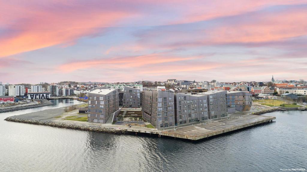 an aerial view of a building on the water at Luxury 3 bedroom seaview apartment, ONS 2024 in Stavanger