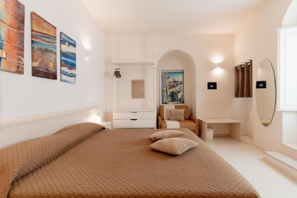 a bedroom with a large bed in a room at Il Belvedere in Matera
