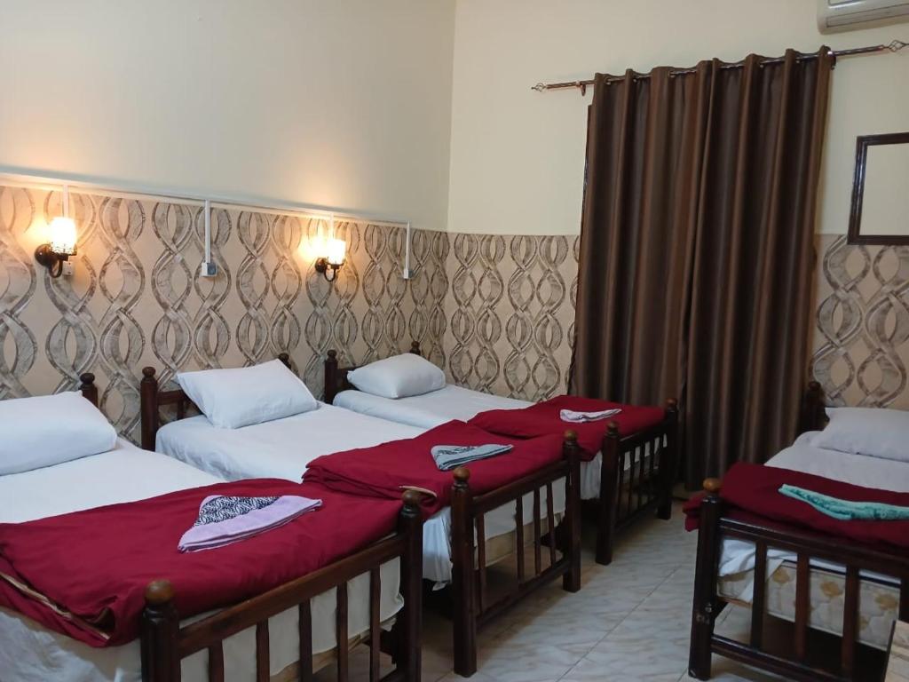 Postel nebo postele na pokoji v ubytování New Palace Hotel