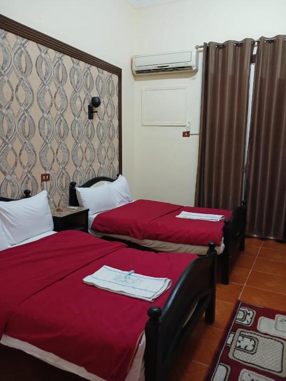 Postel nebo postele na pokoji v ubytování New Palace Hotel