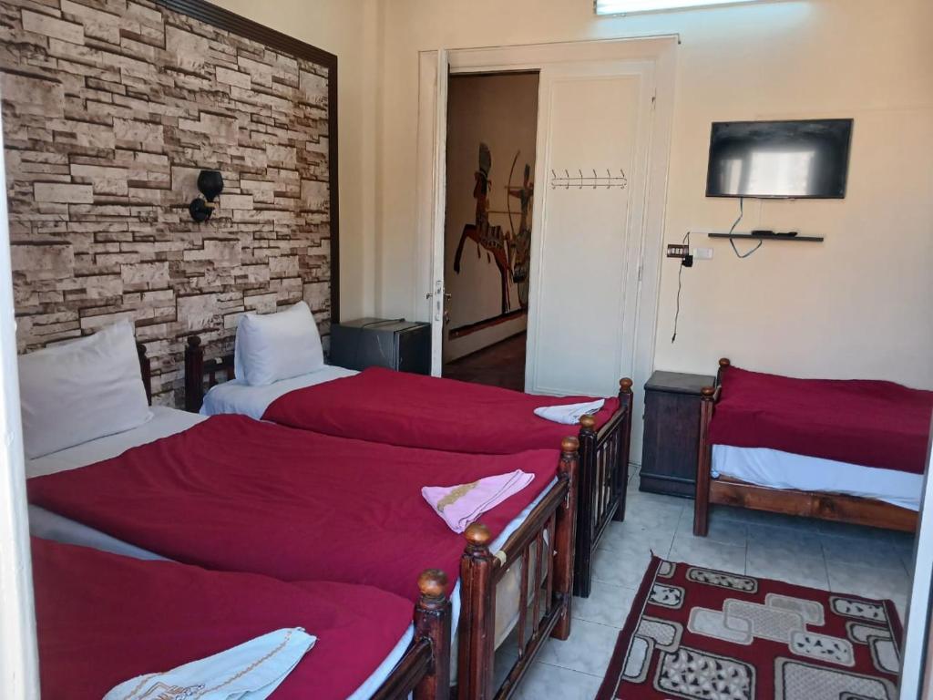 Postel nebo postele na pokoji v ubytování New Palace Hotel