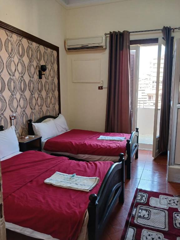 Postel nebo postele na pokoji v ubytování New Palace Hotel