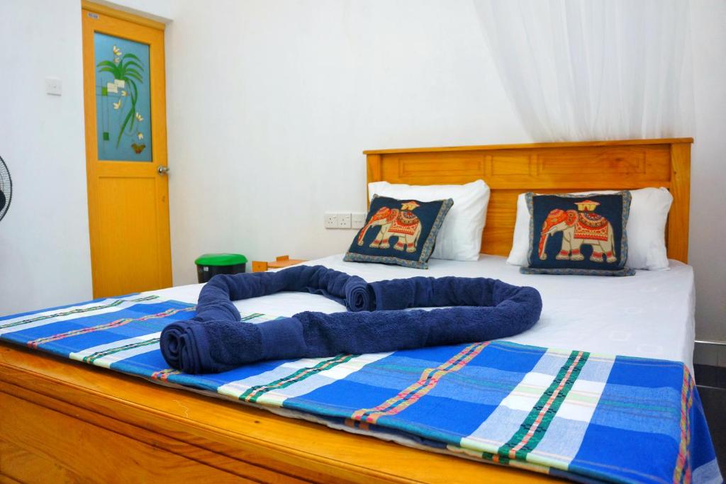 Postel nebo postele na pokoji v ubytování Lily's Garden Resort