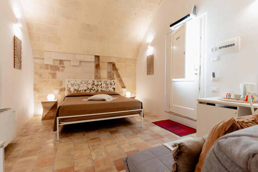 a bedroom with a bed and a window at Il Belvedere in Matera