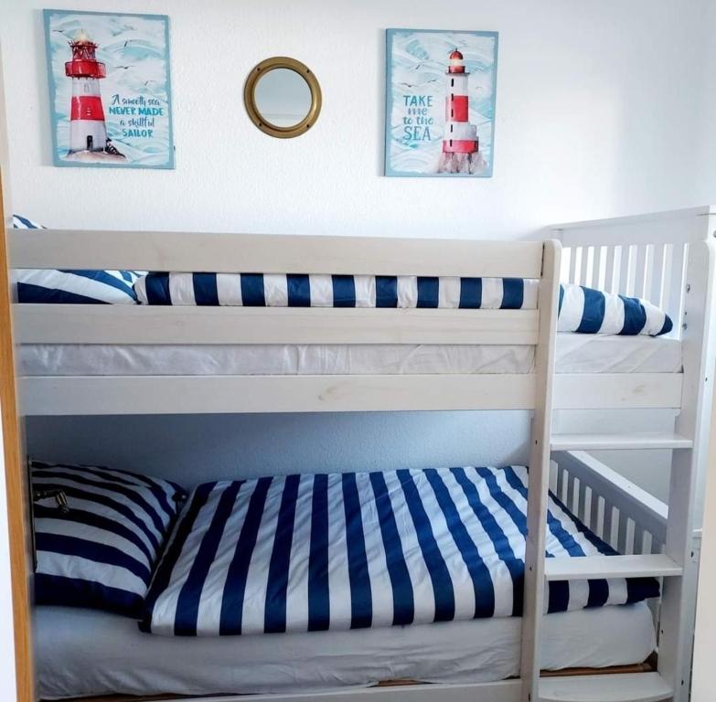 Postel nebo postele na pokoji v ubytování FeWo Meer-Kur