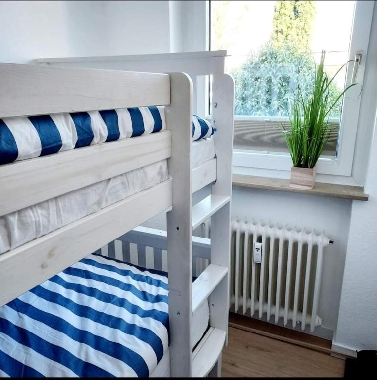 Postel nebo postele na pokoji v ubytování FeWo Meer-Kur
