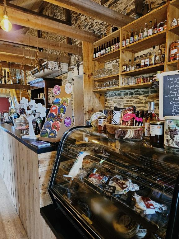 a bakery with a counter and a counter sidx sidx sidx at Camping à la ferme - Hébergements insolites in Cerisy-la-Forêt