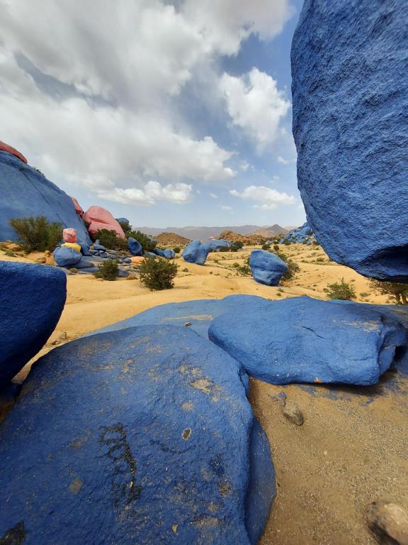 a group of blue rocks in the desert at Tigmi Bulbul in Id AÃ¯ssa