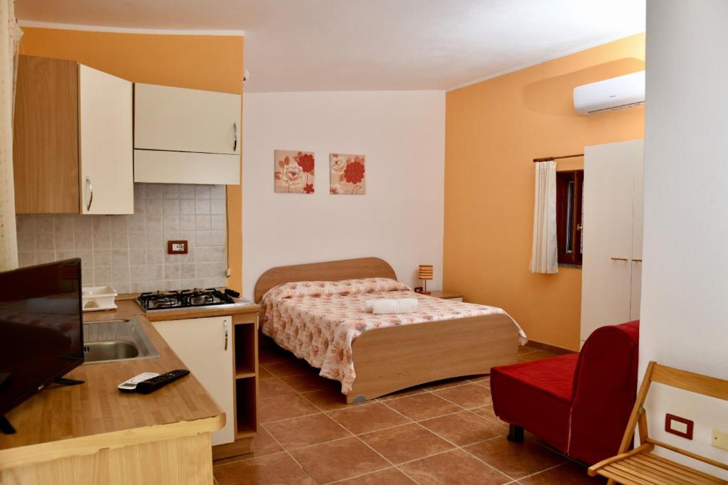 Кровать или кровати в номере Agriturismo Ezzi Mannu