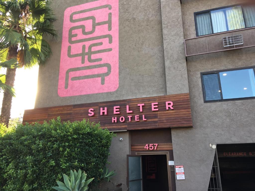 a building with a sign for a shaker hotel at Shelter Hotel Los Angeles in Los Angeles