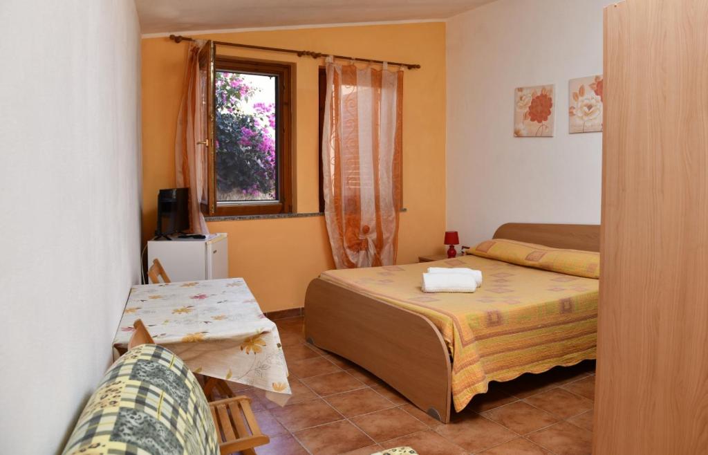 Кровать или кровати в номере Agriturismo Ezzi Mannu