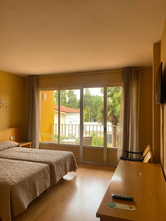 Posteľ alebo postele v izbe v ubytovaní Hotel Zenit Mar