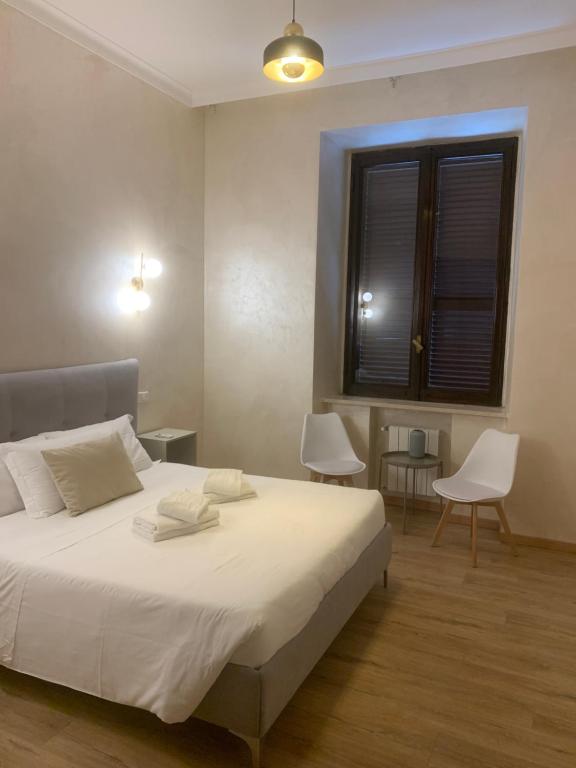 Ένα ή περισσότερα κρεβάτια σε δωμάτιο στο Ten Miles Guesthouse Roma