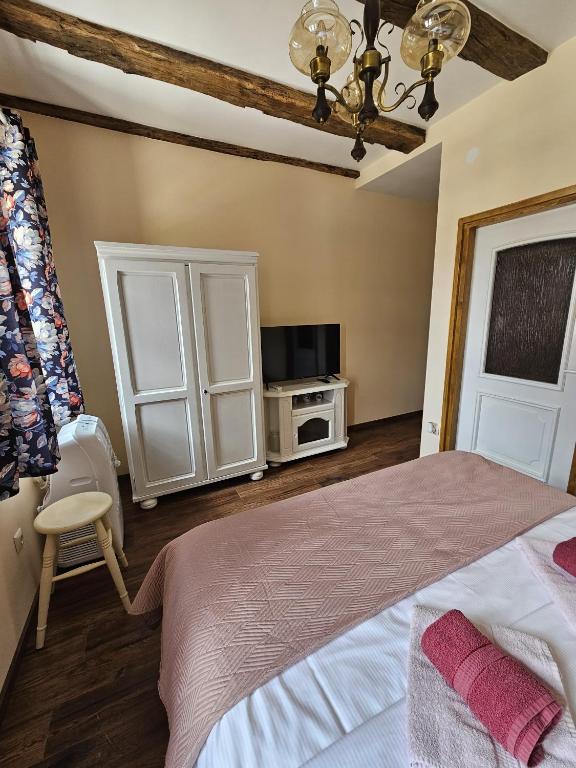 Posteľ alebo postele v izbe v ubytovaní Taverna 1860 Rooms & Apartments