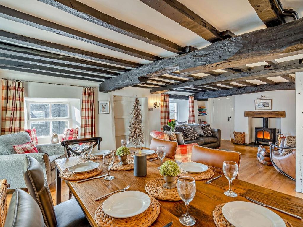 a living room with a wooden table and chairs at 3 Bed in Hawkshead 54193 in Hawkshead