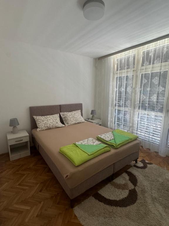 Postel nebo postele na pokoji v ubytování Andjela’s Apartment