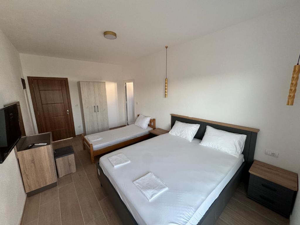 Postel nebo postele na pokoji v ubytování Magda apartments