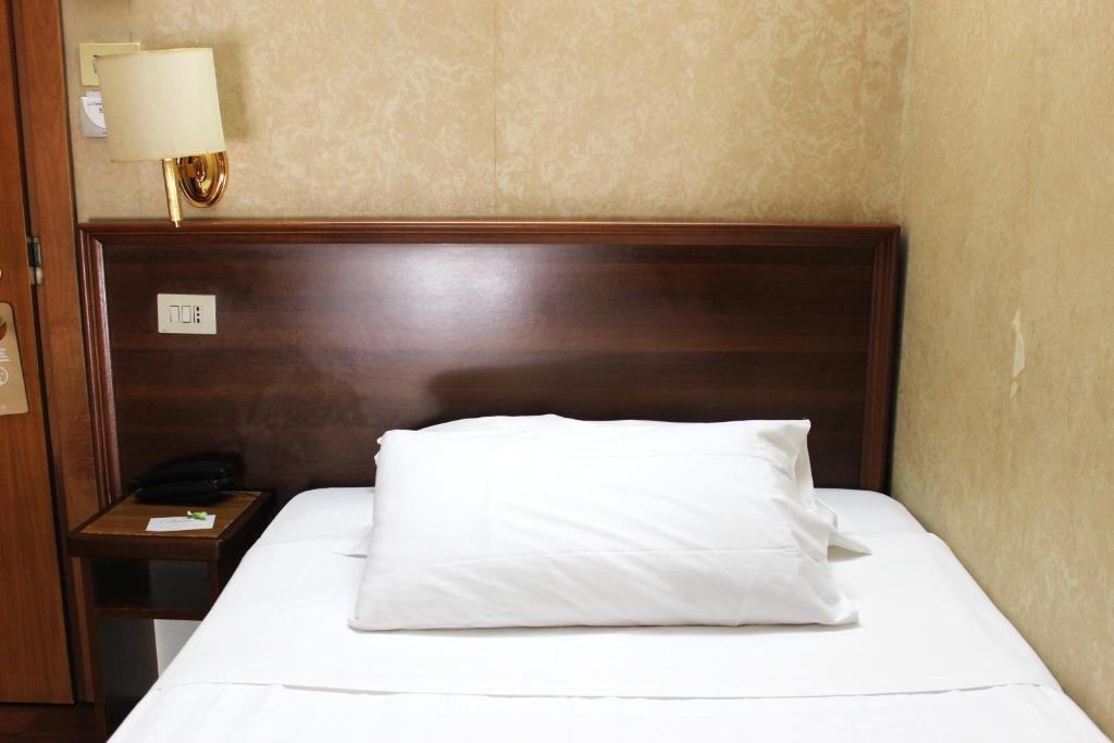 Postel nebo postele na pokoji v ubytování Phi Hotel Ambra