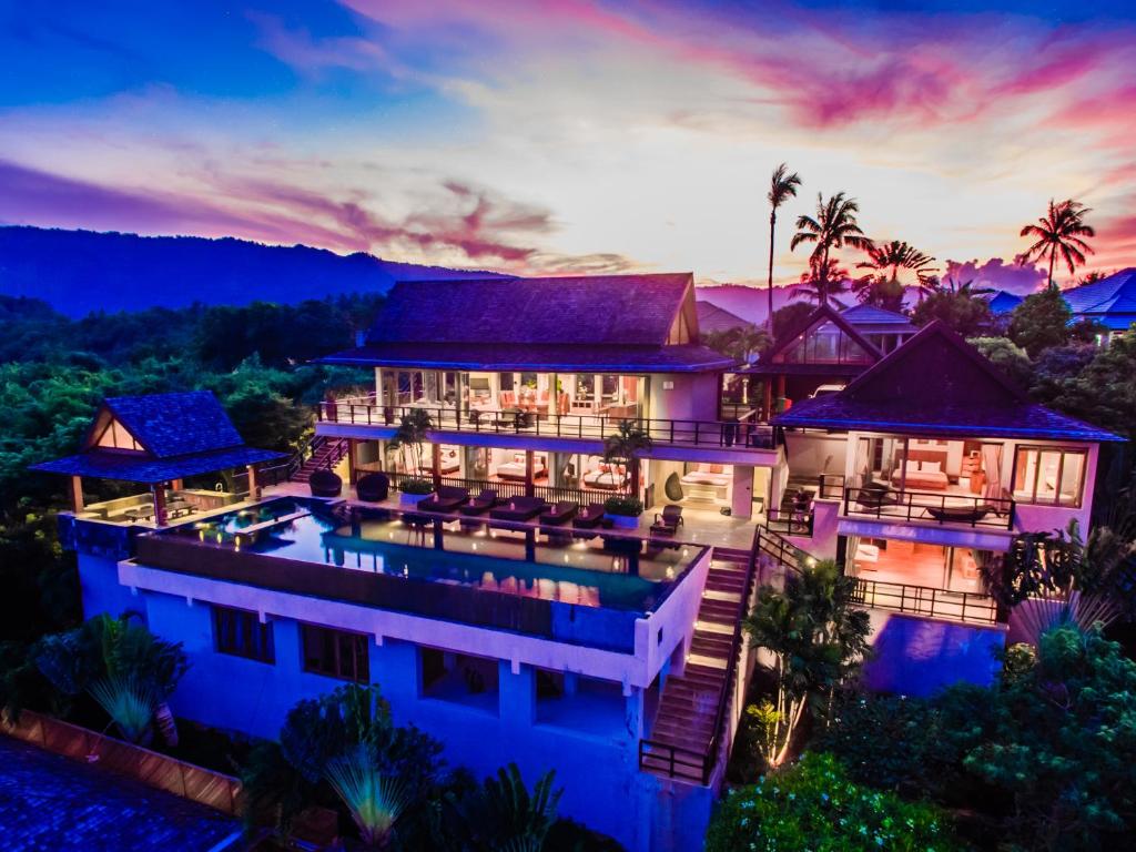 an aerial view of a resort at dusk at Baan Grand Vista - Panoramic Sea View 5 Bed Pool Villa in Bophut